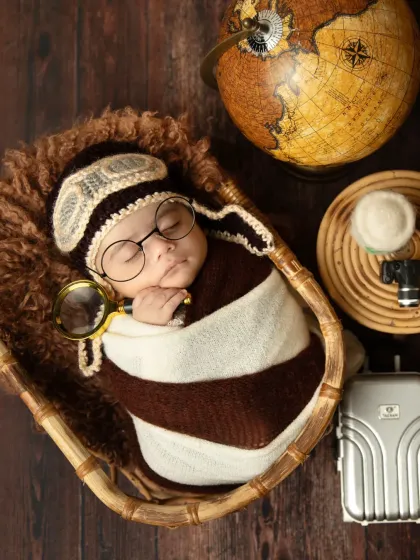 Ready for their first big adventure! This creative traveler-themed shoot is so much fun to put together, with props like a tiny globe, suitcase, and an aviator cap to tell a unique story for your little explorer.