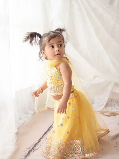 A little girl dressed in a beautiful yellow lehenga for her birthday photoshoot. I love incorporating traditional outfits into sessions.