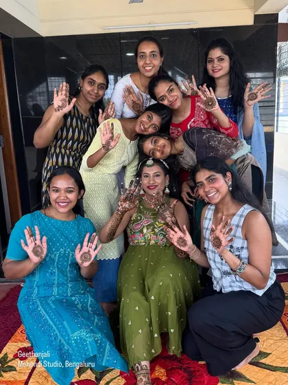 A happy bride surrounded by her friends and family, all showing off their beautiful mehendi designs. I love being a part of these joyful moments.