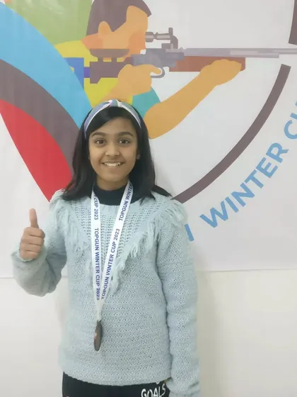 A thumbs-up for a job well done. One of our young medal winners at the TOPGUN WINTER CUP 2023, celebrating her achievement and ready for the next challenge.
