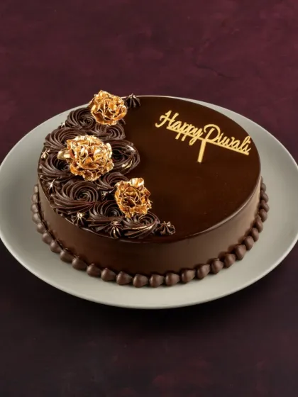 For Diwali, I created this special Belgian Chocolate cake. It's decorated with elegant chocolate swirls and edible gold flowers, making it a luxurious gift for the festival of lights.