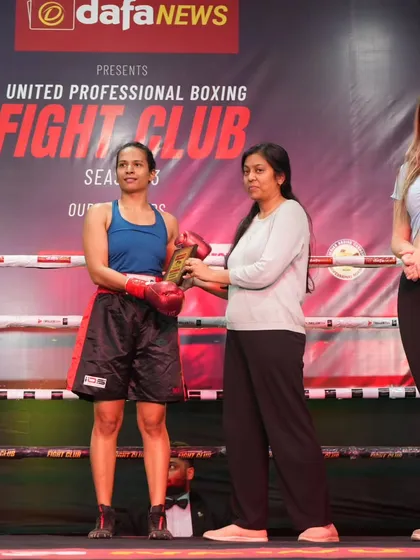 Here is one of our dedicated female boxers receiving her award at the United Professional Boxing Fight Club event. I provide a safe and empowering space for women to learn powerful self-defense skills and compete at a high level.