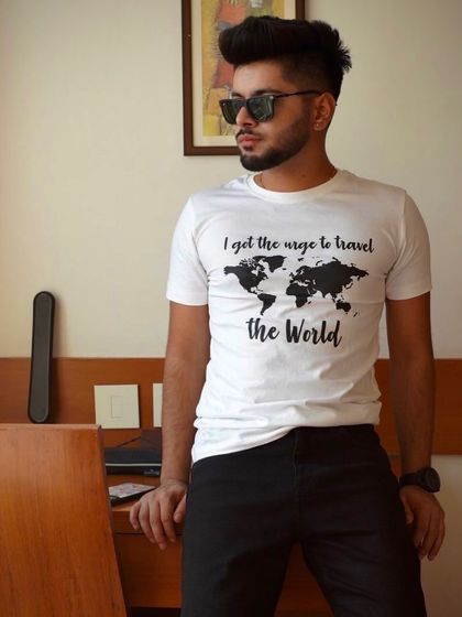 A casual indoor portrait of a model wearing a graphic tee. This simple, clean shot is great for e-commerce or showcasing a relatable, everyday style.