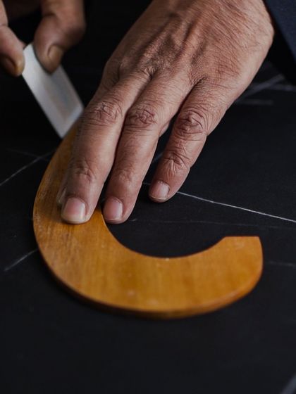 A bespoke pattern is the blueprint for a perfect fit. Our master cutter uses his skill and experience to draw precise lines, accounting for every unique contour of the human form.