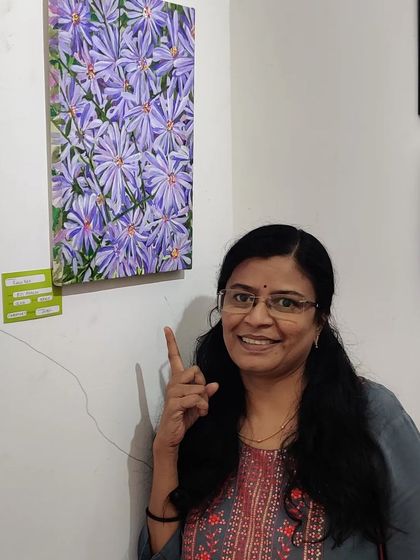 Another shot of me pointing to my floral painting at the gallery.