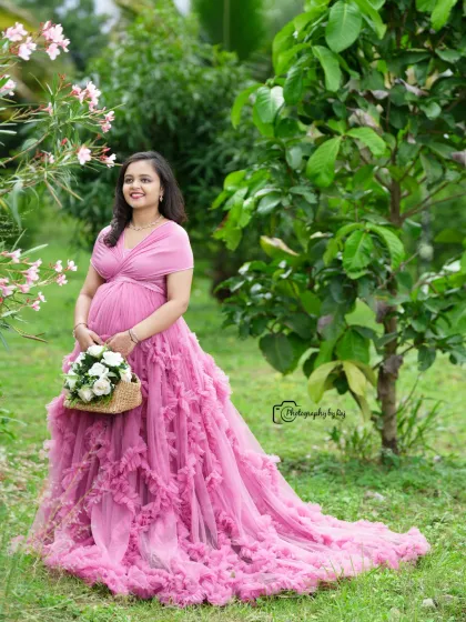 A beautiful solo portrait in a pink ruffled gown, holding a basket of flowers in our garden.