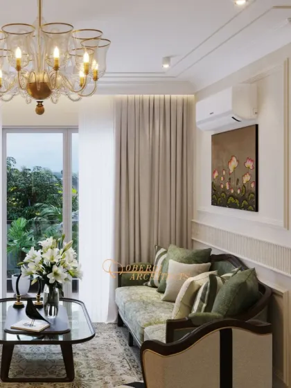 A cozy corner of a classic living room, featuring a sofa with floral-patterned fabric and elegant green cushions, complemented by traditional lighting.