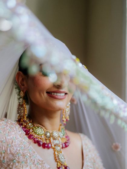 A beautiful, happy shot of my yoga trainer bride, Tithi. Her minimalistic pink and nude makeup palette reflects her serene and natural vibe.