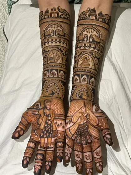A classic bridal design with peacocks, elephants, and a couple portrait, all set against a clean, white background.