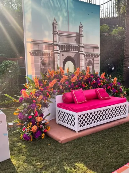A photo corner with a backdrop of the Gateway of India, bringing the spirit of Mumbai to this destination wedding.