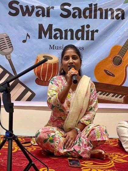 A student sings with pure devotion during our Guru Purnima mehfil. Singing bhajans and devotional songs is a core part of our teaching, focusing on expressing faith through music.