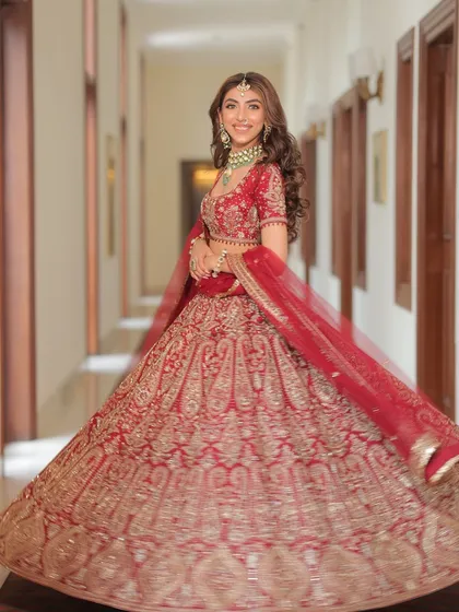 The twirl shot is a must. It shows the beautiful movement and volume of the lehenga, creating a moment of pure joy and celebration for the bride.