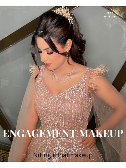This image captures the essence of her engagement makeup. The soft glam, the elegant hairstyle, and the sparkling dress all came together perfectly.