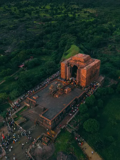 Another stunning aerial perspective of the Bhojpur Temple, highlighting its unique, open-roof structure and the long lines of faithful visitors.