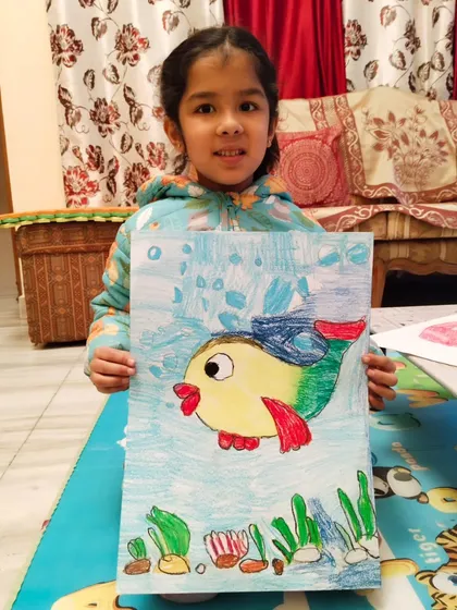 Another proud student with her colorful fish. These sessions are all about building confidence and having fun with the fundamentals of art.