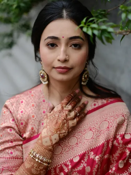 The rich stain of the henna looks stunning against the elegant silk sari. This is the beautiful final result of my patient work.