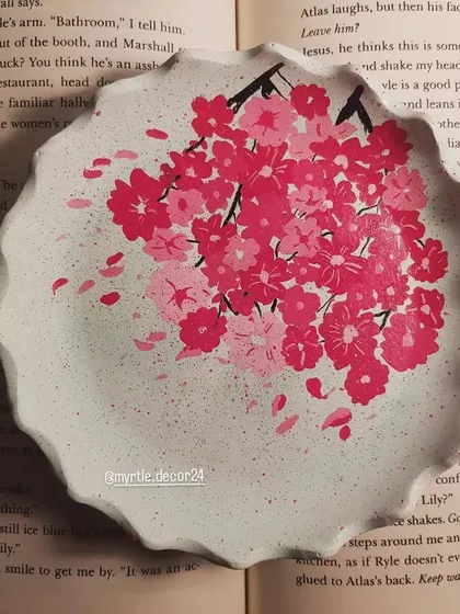 Our hand-painted cherry blossom round tray, a unique piece that combines texture and art.