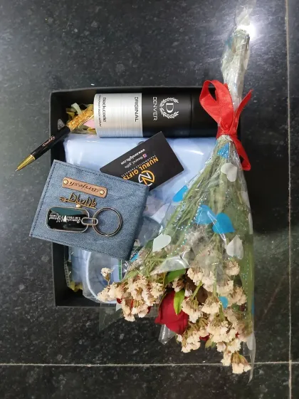 This gift set, complete with a personalized denim wallet, keychain, shirt, and flowers, is ready to bring a smile to someone's face.
