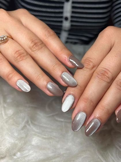 Cat eye nails are so trendy right now. This set features a mix of neutral brown and white cat eye polish.