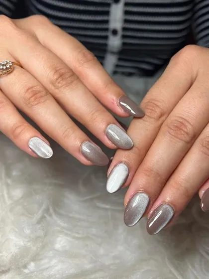 Cat eye nails are so trendy right now. This set features a mix of neutral brown and white cat eye polish.