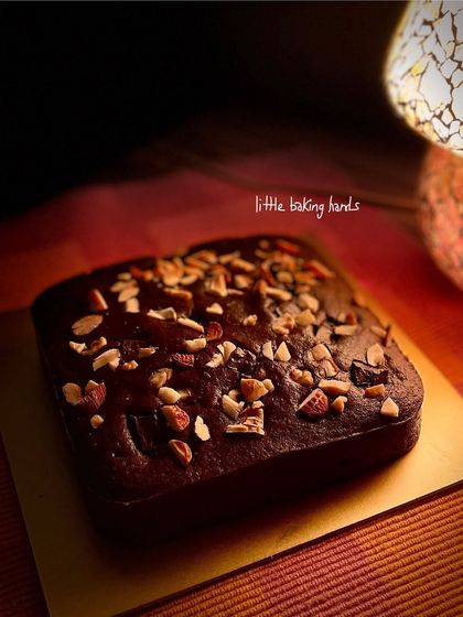 Another angle of the chocolate nuts cake, showing off its simple, rustic charm under warm lighting.
