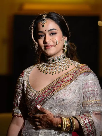On her big day, every detail was meant to reflect who she is: elegant, bold, and timeless. Her custom-made diamond and green stone necklace set was not just jewellery, it was a symbol of love, carefully crafted to shine as bright as her journey ahead.