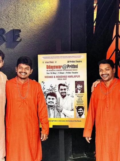 A photo with the Harlapur brothers outside Prithvi Theatre, a venue known for its unique acoustic experience.