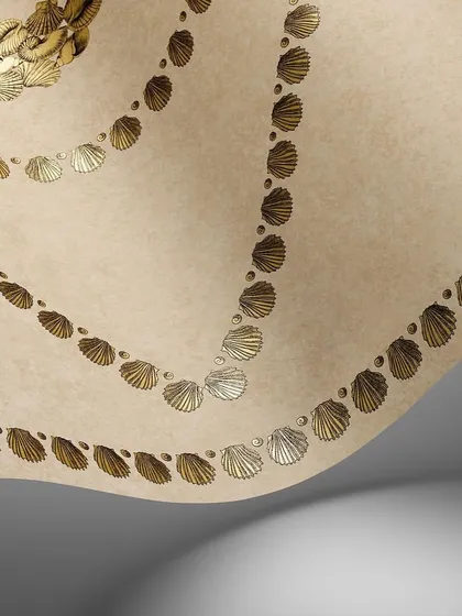 The Conchiglie design in a soft, neutral colorway. The delicate metallic shells form a subtle yet sophisticated pattern, perfect for adding a touch of understated elegance to any space.