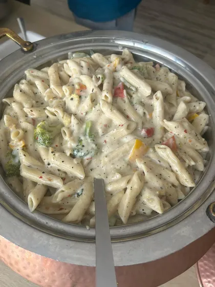 Creamy white sauce pasta served hot from the chafing dish. This continental favorite is a staple in my corporate menus, offering a comforting and delicious option for employees and guests.