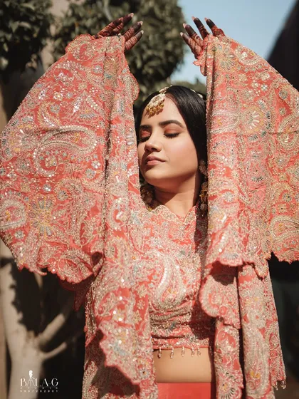 Embracing the moment. Yashi's Haldi look is all about effortless beauty, with soft makeup that enhances her features and lets her enjoy the festivities.