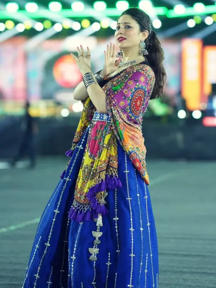 A full-length shot showcasing the beautiful flare of my traditional blue outfit for the festival.