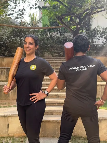 My partner and I with our Callipers Fitness T-shirts, ready for an Indian Mugdhar Vyayam session.