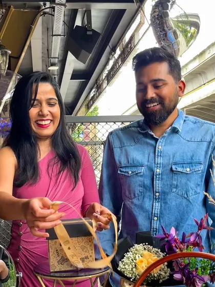 A candid shot of a couple enjoying their surprise. It's these small, in-between moments of laughter and connection that I love to create.