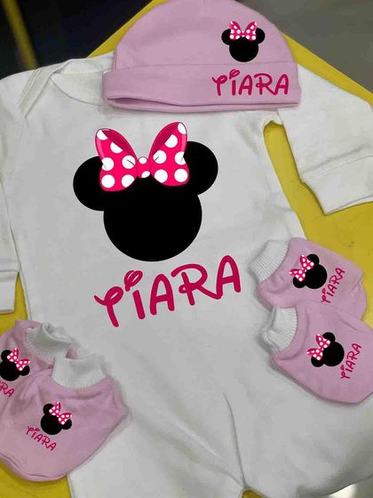 A cute Minnie Mouse themed romper set for a baby girl. The romper, cap, and mittens are all personalized with her name and the iconic Minnie silhouette.