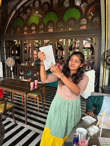 Me, explaining a technique during a texture art workshop. I make sure everyone feels supported and confident.