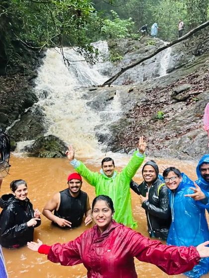 Our trekkers taking a well-deserved, fun-filled break in a stream on the way to Kodachadri peak.