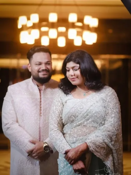 A sweet, candid moment between the couple. His smile and her gentle downward glance create a natural and romantic portrait from their Roka celebration.
