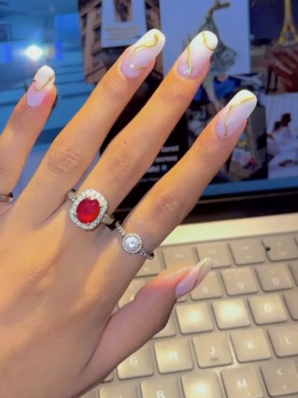 Another shot of these beautiful milky white nails with abstract gold lines, showing how they look in a different light.