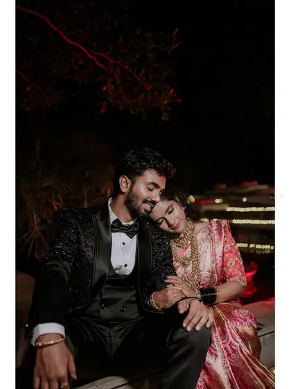 A quiet moment of togetherness during a lively reception. Amidst all the celebration, we find the calm, intimate connections that truly define your relationship.