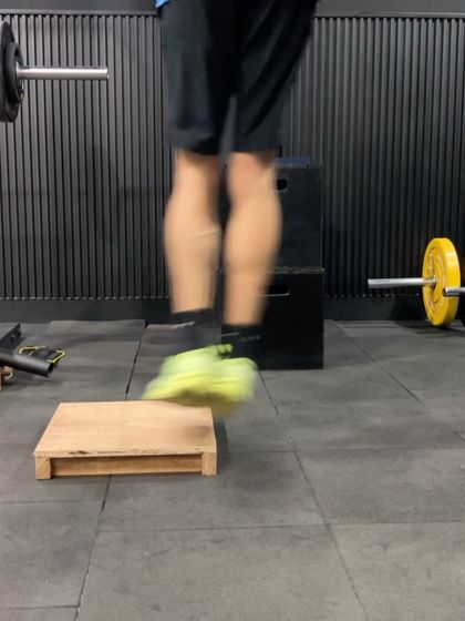 A close-up of the feet during a plyometric drill, showing the importance of a quick and powerful push-off from the ground.