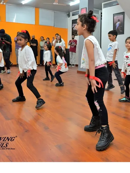 A side view of our kids' class, showing their focus and enthusiasm as they learn a new piece of choreography.