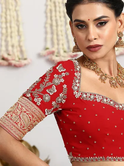 The beauty of our craft lies in the details. Here is a closer look at the exquisite hand-embroidery on a bridal blouse, where every sequin and thread is meticulously placed to create a work of art.