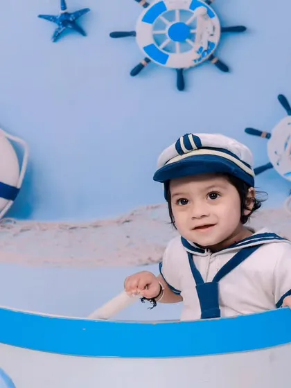 A close-up of our little sailor, ready to set sail in his boat.