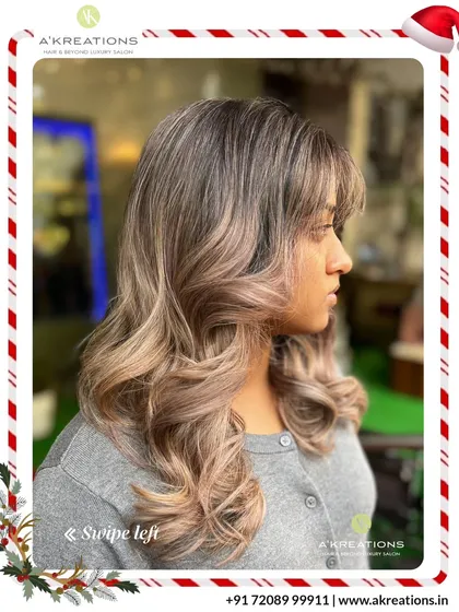This stunning ash-blonde balayage creates a beautiful gradient effect. The soft curls at the end add volume and showcase the seamless color transition.