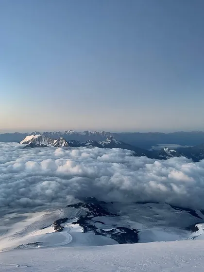 A view from the summit of Mt. Elbrus, Europe's highest peak. Looking down on a world blanketed by clouds is a humbling experience that reminds us why we climb.