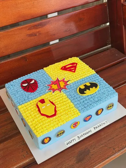 Sheet cakes are perfect for larger gatherings. This one features a fun superhero theme, with sections for Spiderman, Superman, Batman, and Iron Man.