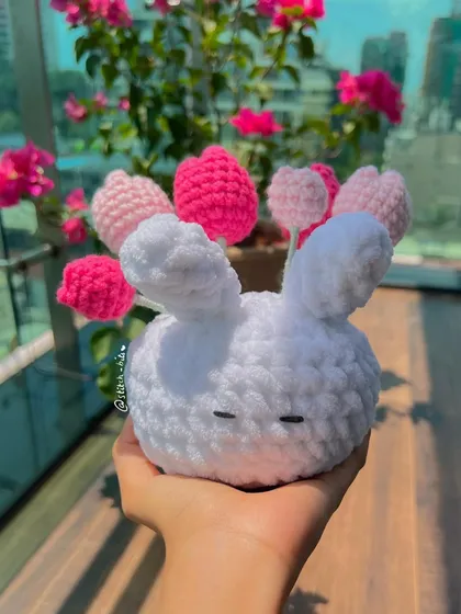 I brought a Pinterest idea to life with this crochet bunny vase. It's holding a bouquet of my handmade pink tulips that will stay bright forever.