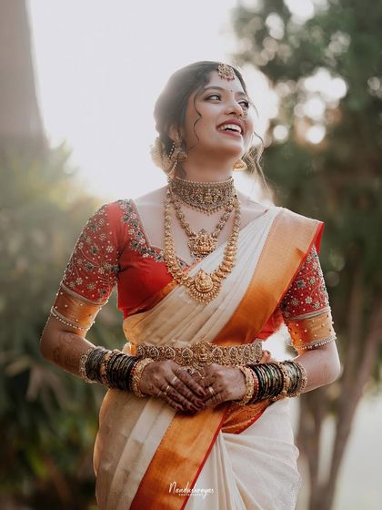 A beautiful, happy portrait of the bride. Her genuine smile and the soft backlighting create a warm and timeless image of bridal beauty.