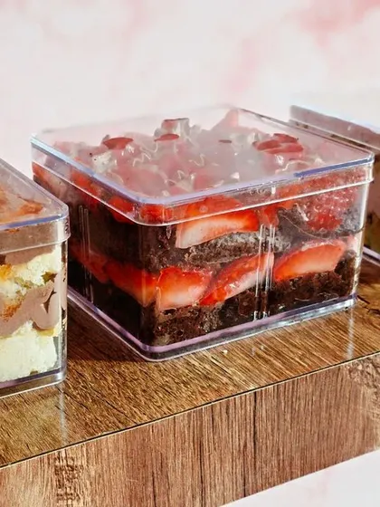 Meet my trendy Tub Cakes, the perfect single-serving dessert. This shows some of my favorite assorted flavors: the decadent Chocolate Strawberry, the elegant Rose Pistachio, and the zesty Chocolate Orange.
