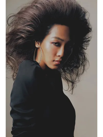 A striking portrait from the 'Patricia' series that focuses on form and emotion. The dramatic hair volume and direct gaze showcase my approach to beauty photography, where I aim to capture both strength and vulnerability.